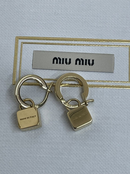 Miu Miu orecchini in metallo dorato e rosa orchidea