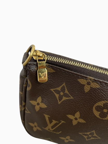 Primo piano della cerniera dorata e dell'angolo in tela Monogram Louis Vuitton