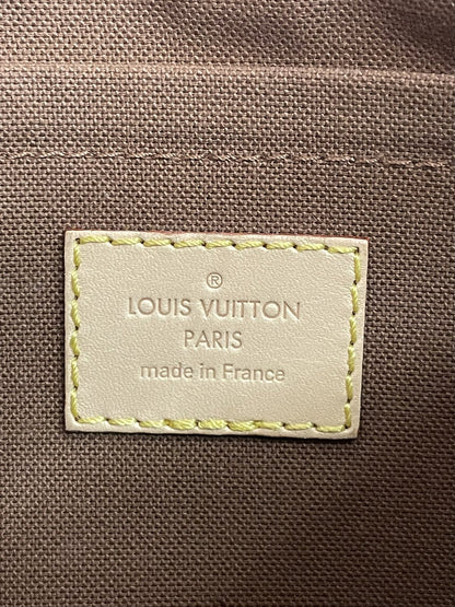 Etichetta interna in pelle con scritta Louis Vuitton Paris Made in France