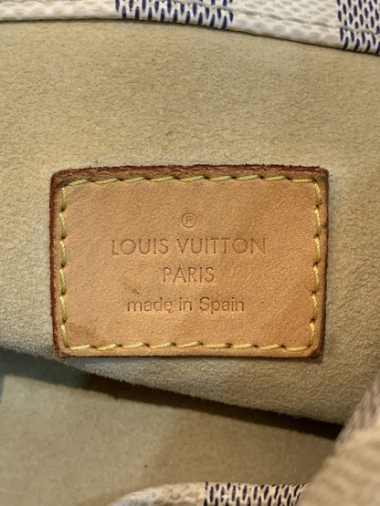 Dettaglio marchio impresso su tasca interna in pelle Made in Spain