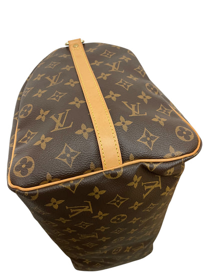 Dettaglio della base e del profilo laterale in pelle vacchetta della borsa Louis Vuitton Speedy 40